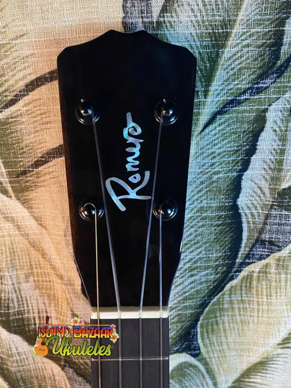 Black ukulele headstock with blue Rogue logo on Romero Creations Spalted Mango Tenor