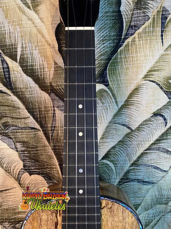 Guitar neck with frets and tropical leaves on Romero Creations Spalted Mango Tenor Ukulele