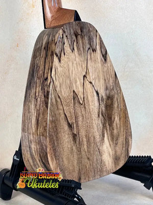 Wooden pear sculpture showcasing grain patterns on Romero Creations Tiny Tenor Ukulele