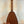 Wooden pineapple-shaped Romero Creations ukulele with dark brown finish and polyfoam case