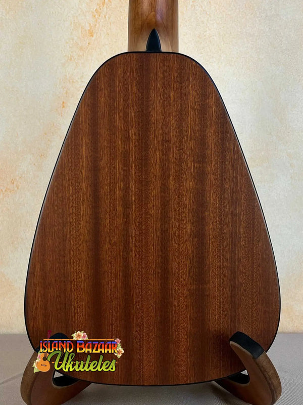 Wooden guitar back panel on display stand for Romero Solid Top Ukulele with Polyfoam Case