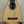 Triangle-shaped natural wood ukulele from Romero Creations with polyfoam case