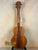 Wooden ukulele with natural finish and black tuning pegs from KoAloha Royal Pikake