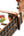 Guitar capo attached to fretboard with Island Breeze branding for Swiff Ukulele K8-U