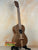 Dark brown Tenor Acacia Ukulele with natural wood grain in Beginners Bundle set