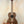 Wooden tenor acacia ukulele featuring dark grain patterns in Acacia Ukulele Beginners Bundle