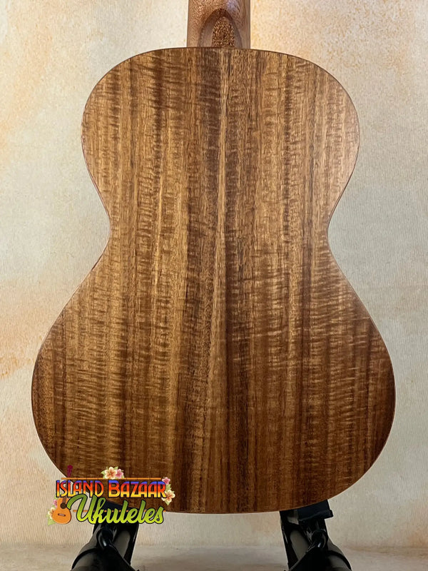 Acoustic guitar with figured walnut back in Tenor Acacia Ukulele Beginners Bundle