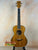 Beautiful tenor mango ukulele with figured koa wood grain in Beginners Bundle