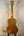Wooden acoustic guitar with natural finish featured in Tenor Mango Ukulele Beginners Bundle