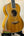 Beautiful wooden tenor mango ukulele with rich honey-colored grain in beginners bundle