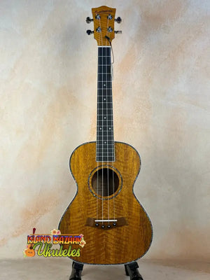 Beautiful tenor mango ukulele showcasing figured koa wood grain in beginners bundle