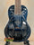 Black resonator concert ukulele with palm tree design from Tradewinds Resonator Concert collection