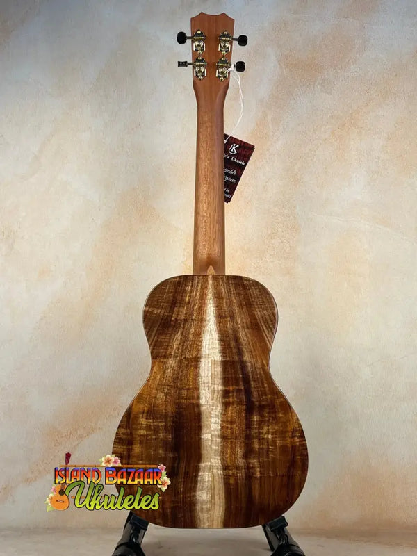 Acoustic guitar with rich brown Hawaiian Koa, highlighting the Kanile’a KPA Premium Tenor Ukulele