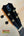 Guitar headstock with black finish and gold tuning pegs on Kanile’a KPA Premium Tenor Ukulele