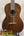 Vintage martin custom baritone ukulele with rich dark brown wood glossy finish and white binding edges pre-owned