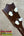 Dark brown wooden vintage martin custom baritone ukulele headstock with four white plastic tuning pegs