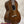 A polished dark brown vintage martin custom baritone ukulele with glossy finish and white binding edges with case