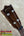 Dark brown wooden headstock of a vintage martin custom baritone ukulele from the late 1960s pre owned