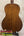 Back of a warm-toned vintage martin baritone ukulele with glossy wood grain finish custom late 1960s model