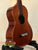 Brown wooden Vintage Martin Soprano Ukulele from the 1940s-50s, well-loved and modified