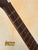 Guitar fretboard with strings on a Vintage Martin Soprano Ukulele from the 1940s-50s