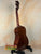 Brown Vintage Martin Soprano Ukulele on a stand, showcasing its 1940s-50s charm