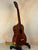 Brown wooden Vintage Martin Soprano Ukulele from the 1940s-50s, well-loved and modified